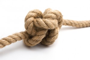 Tied up rope knot isolated on a white background
