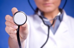 Woman doctor holding stethoscope. Nurse