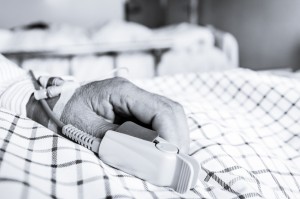The patient's hand on the bed