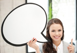 smiling businesswoman with blank text bubble