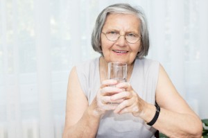Senior woman drinking water