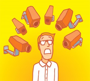 Man surrounded by surveillance cameras