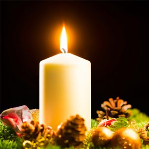 Christmas decoration with a burning candle
