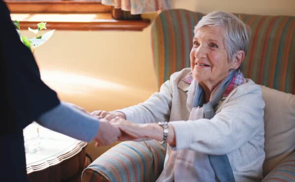 Domiciliary Home Care worker helping a service user